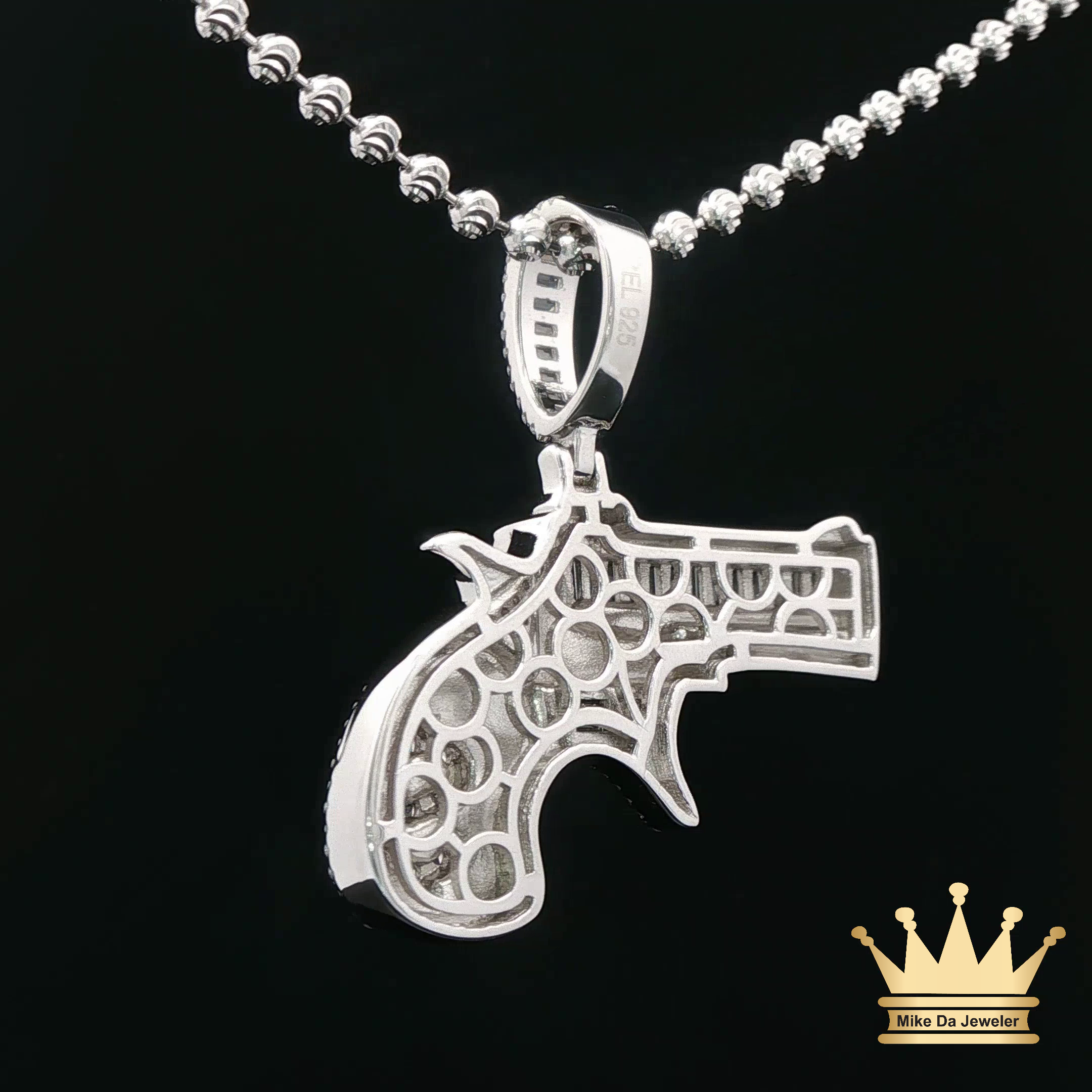 Silver Revolver Pendant with Green Enamel Accents