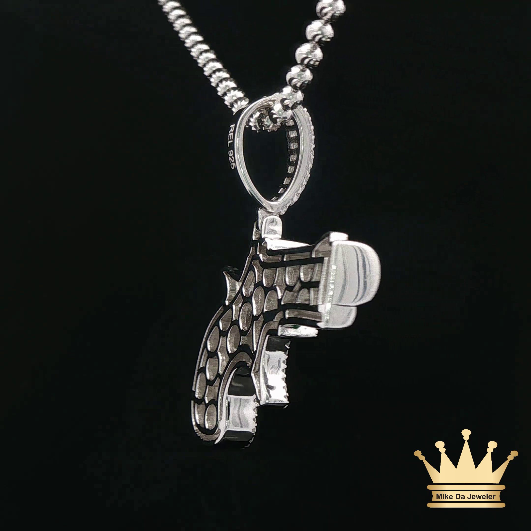 Silver Revolver Pendant with Green Enamel Accents
