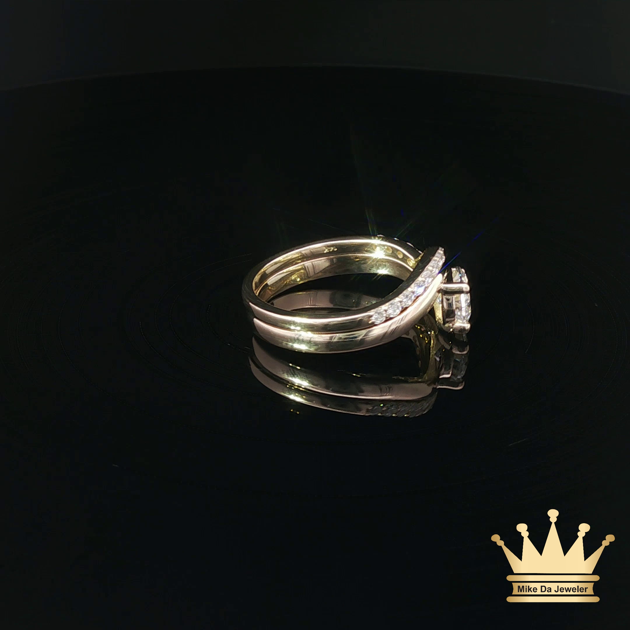 Pear-Shaped Diamond Bypass Engagement Ring and Contoured Diamond Band Set in Yellow Gold